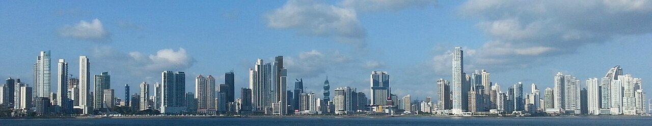 Panama City skyline across the bay under blue sky